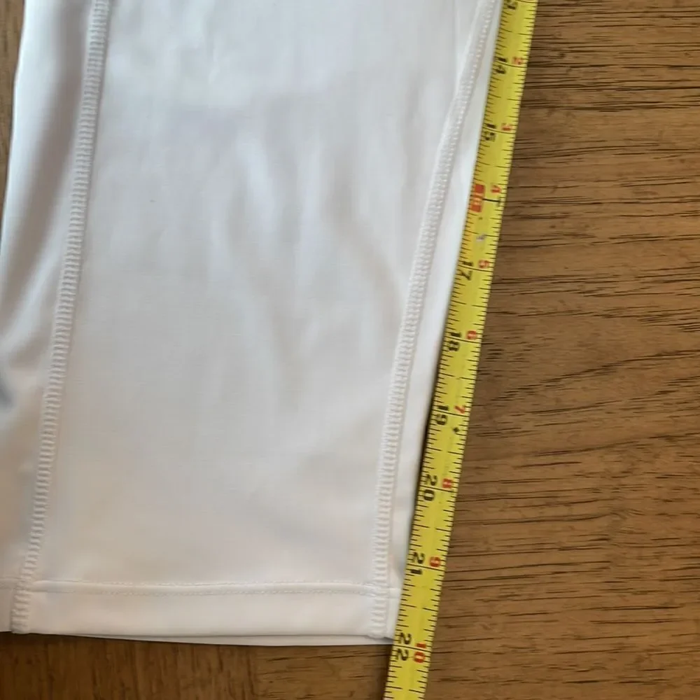 Kcutteyg white exercise capris with side pockets.  New with tags